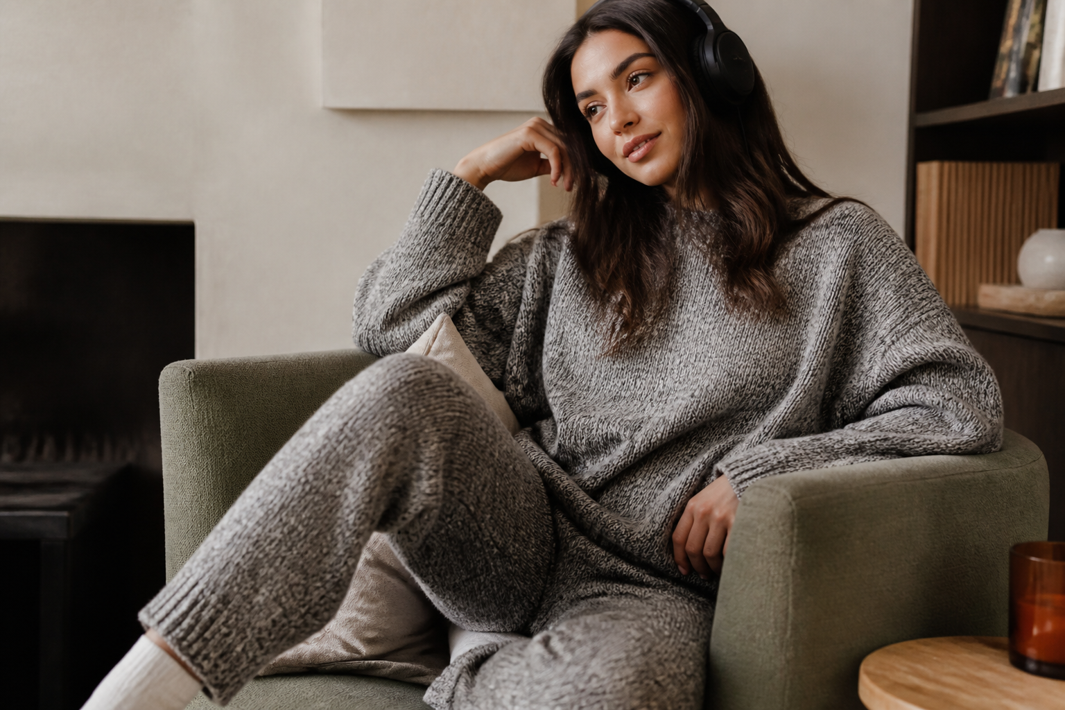 Quiet luxury knit look in a green armchair